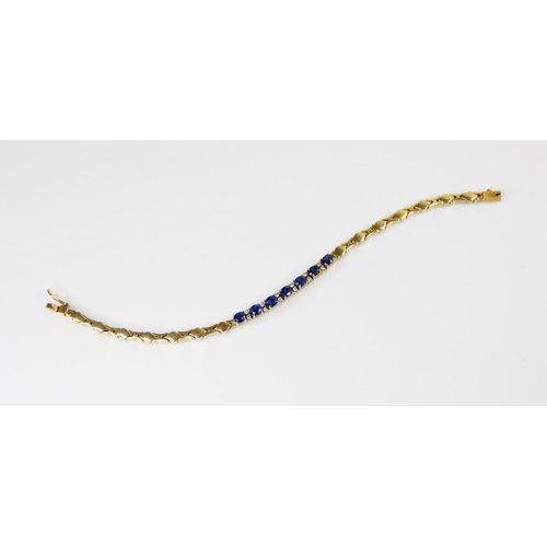 125 - A sapphire doublet and diamond set line bracelet, comprising seven oval mixed cut sapphire doublets,... 