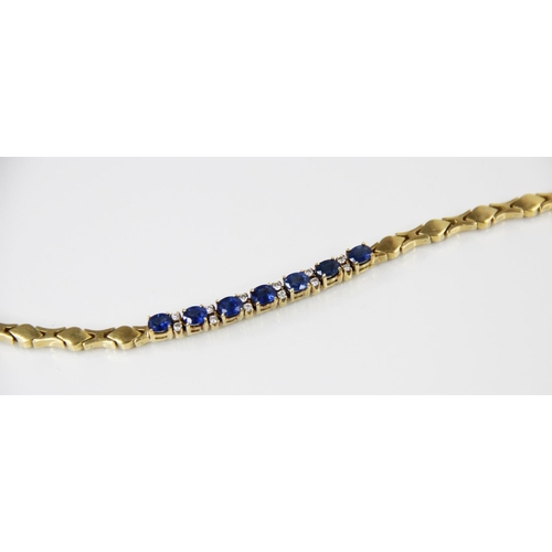 125 - A sapphire doublet and diamond set line bracelet, comprising seven oval mixed cut sapphire doublets,... 