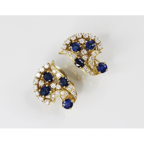 134 - A pair of sapphire and diamond spray earrings by Gazdar, each comprising three oval mixed cut sapphi... 