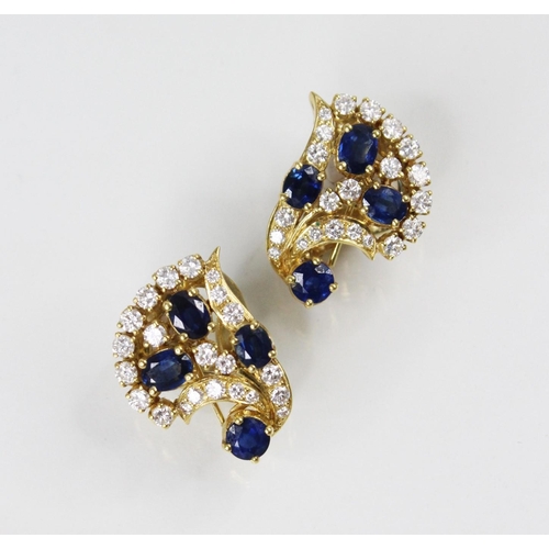 134 - A pair of sapphire and diamond spray earrings by Gazdar, each comprising three oval mixed cut sapphi... 