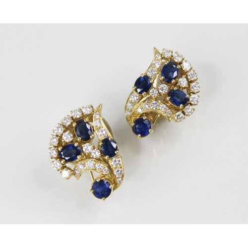 134 - A pair of sapphire and diamond spray earrings by Gazdar, each comprising three oval mixed cut sapphi... 