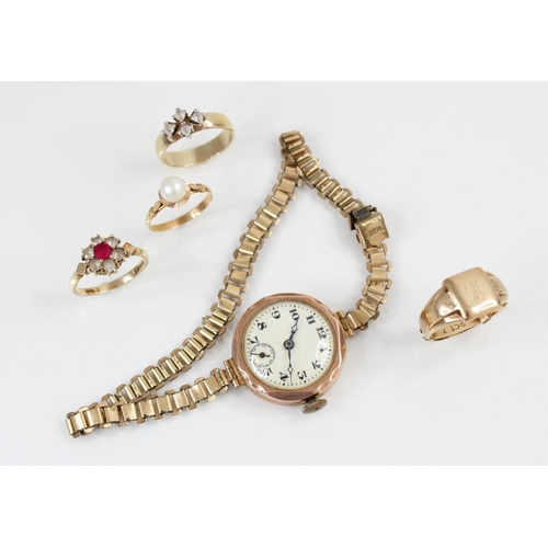 139 - A lady's vintage 9ct gold wristwatch, circa 1935, the round cream dial with Arabic numerals and subs... 