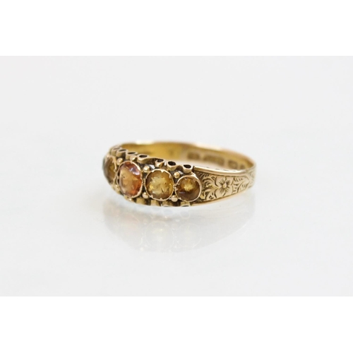 149 - A Victorian 15ct gold five stone ring, comprising a central round mixed cut hessonite garnet (measur... 