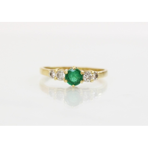 152 - An emerald and diamond 18ct gold ring, the central round mixed cut emerald (measuring 5mm diameter),... 