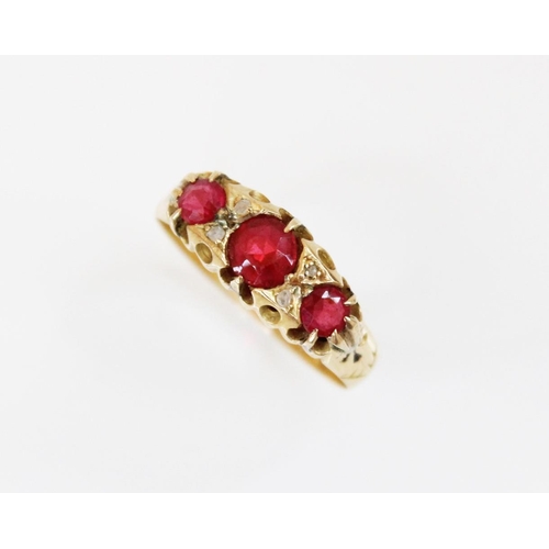 161 - An early 20th century synthetic ruby and diamond ring, comprising three round mixed cut rubies, meas... 