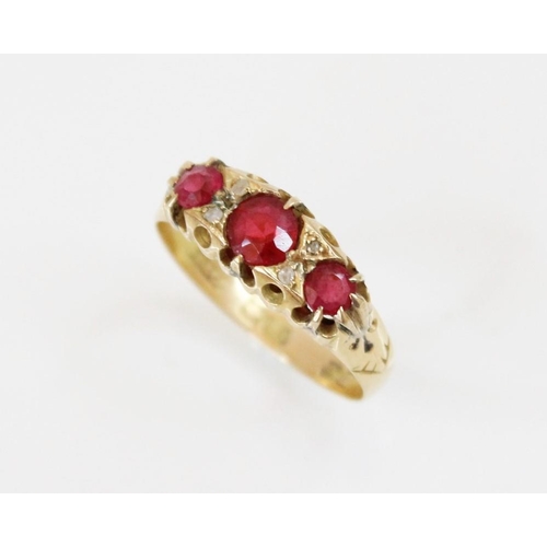 161 - An early 20th century synthetic ruby and diamond ring, comprising three round mixed cut rubies, meas... 