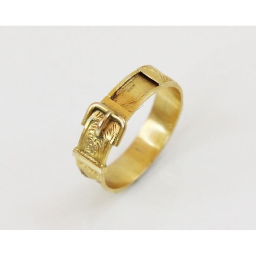 164 - A 19th century yellow metal memorial buckle ring, with engraved decoration, vacant hair panel shank,... 