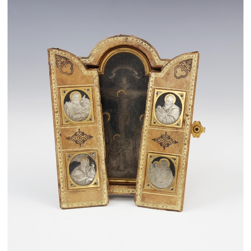 180 - A silver gilt and Niello travelling triptych, 19th century, the central arched panel depicting the c... 