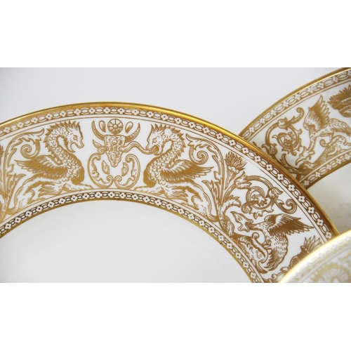 215 - A Wedgwood 'Gold Florentine' part dinner service, W4219, comprising: a meat plate, twelve dinner pla... 