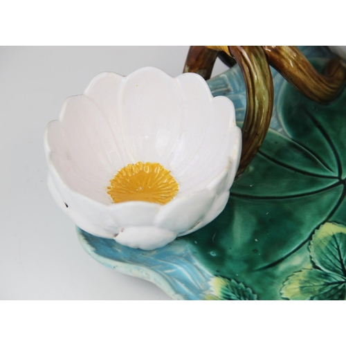 217 - A George Jones majolica strawberry dish, late 19th century, modelled as a lily pad on ozier ground w... 