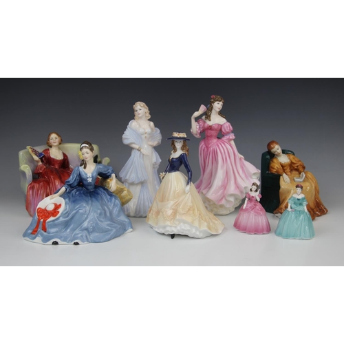 218 - A collection of Royal Doulton figurines, comprising: HN3975 'Lauren' (figure Of The Year 1975), HN12... 