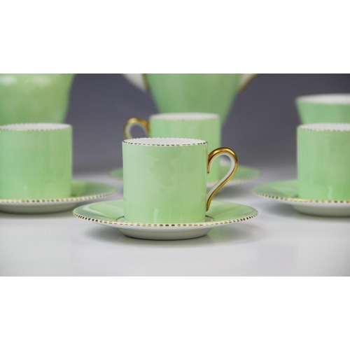 220 - A Wedgwood apple green six setting coffee service, early 20th century, comprising: six coffee cans, ... 