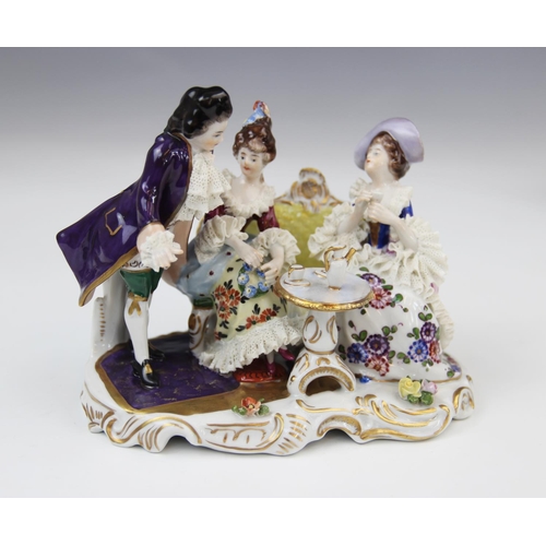 228 - A Volkstedt porcelain figural group, mid 20th century, modelled as a gentleman reading to a lady, 14... 