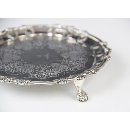 28 - A George III Irish silver waiter, possibly by Thomas Townsend, of circular form with scalloped borde... 