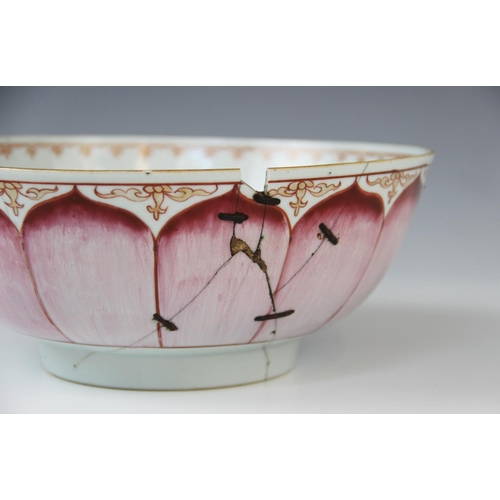 282 - A Chinese famille rose Lotus bowl, 18th century, with spearhead border and outlined floral motif to ... 