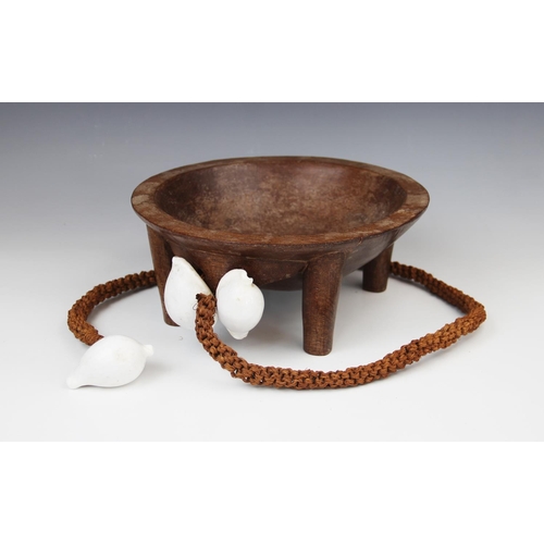 301 - A Polynesian Fiji kava bowl with attached coconut fibre sennit cord and cowrie shells, 26.5cm diamet... 