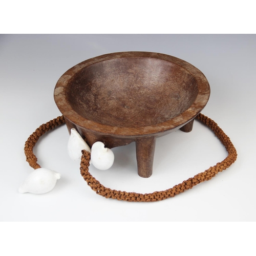 301 - A Polynesian Fiji kava bowl with attached coconut fibre sennit cord and cowrie shells, 26.5cm diamet... 