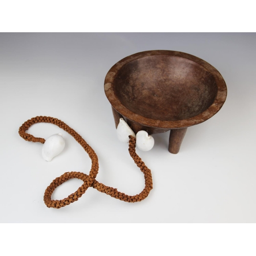 301 - A Polynesian Fiji kava bowl with attached coconut fibre sennit cord and cowrie shells, 26.5cm diamet... 