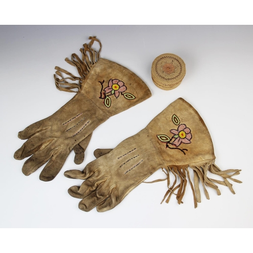 304 - A pair of Native American beaded gauntlet gloves, 35cm, a small North West Coast Nootka woven basket... 