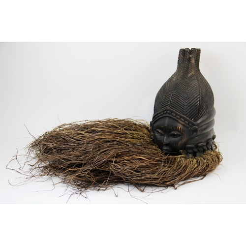 307 - A West African Mende Sierra Leone helmet mask with raffia, 40cm