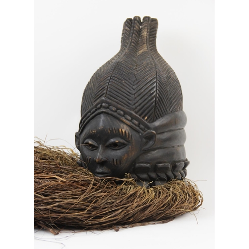 307 - A West African Mende Sierra Leone helmet mask with raffia, 40cm