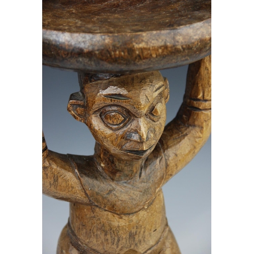 308 - A West African Cameroon grassland stool with figure, 42.5cm high