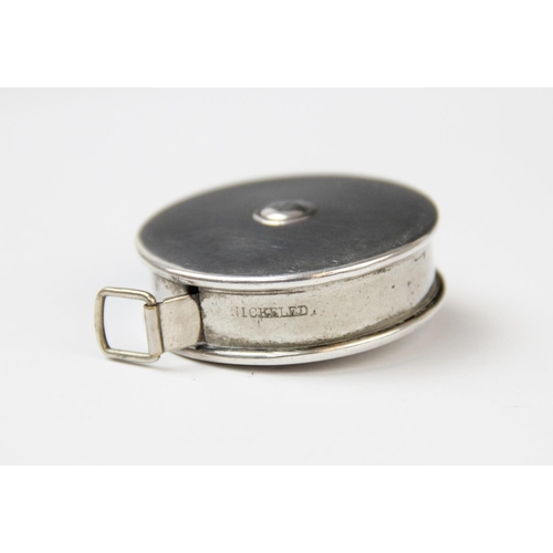 33 - A George V silver and white metal cased tape measure by Crisford & Norris, Birmingham 1914, of circu... 