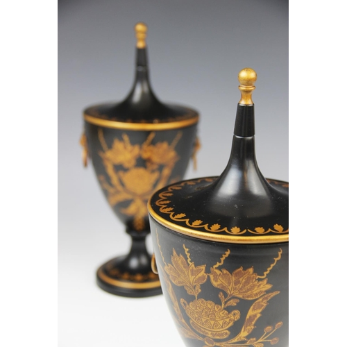 331 - A pair of Regency style Toleware chestnut urns and covers, of goblet form on knopped stem to spreadi... 