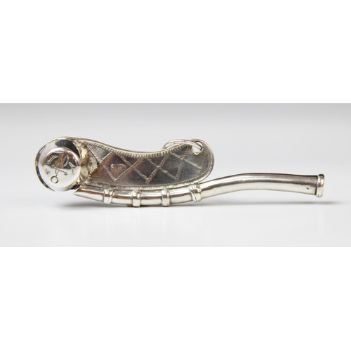 34 - A late 19th century white metal boson's whistle, of typical form with engraved decoration, marked in... 
