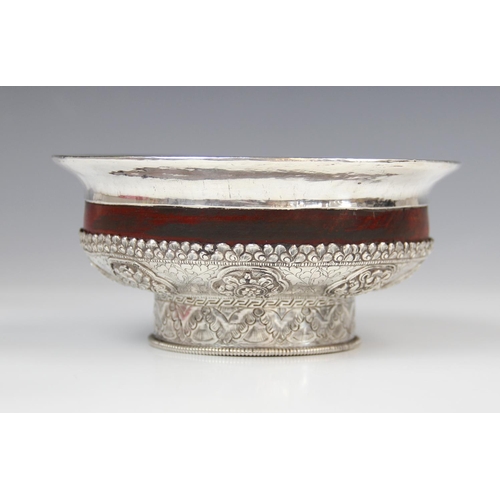 346 - A Tibetan wood and white metal offering bowl, 15cm diameter