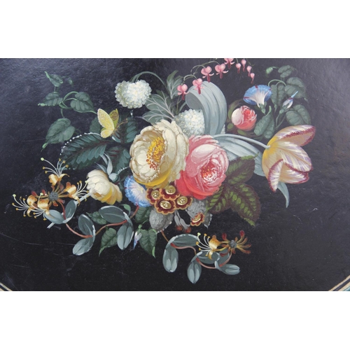 349 - A Victorian black lacquered papier mache tray, mid 19th century, of oval form, hand painted with flo... 