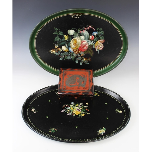 349 - A Victorian black lacquered papier mache tray, mid 19th century, of oval form, hand painted with flo... 