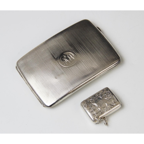 38 - A George V silver cigarette case by Charles S Green & Co Ltd, Birmingham 1919, of rounded rectangula... 