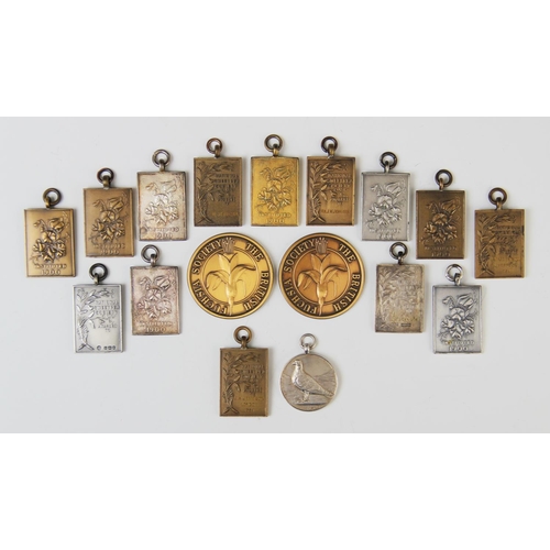 39 - A collection of fob medals for the 'National Sweet Pea Society', mid-20th century, including one sil... 