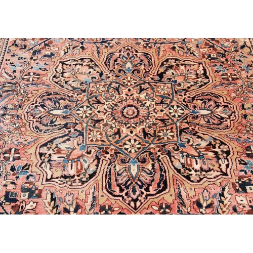 400 - A large Persian Tabriz wool carpet, the central floral medallion engulfed with formal foliate scroll... 