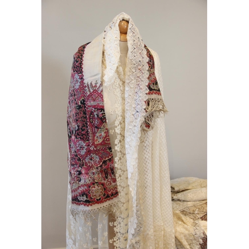 405 - A collection of 19th century and later white and blonde lace shawls, with floral and foliate decorat... 