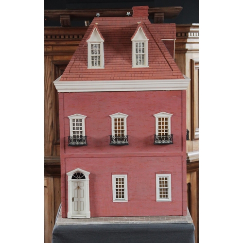 412 - A handmade craftsman built dolls house by Bernardo Traettino dating to 1988, modelled as a three sto... 