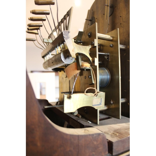 586 - An early 20th century oak cased Westminster chime longcase clock, the arched hood with barley twist ... 