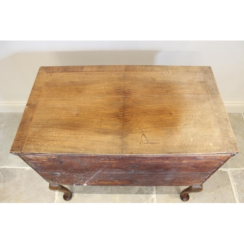 603 - An early 18th century figured walnut side table/low boy, the quarter veneered and cross banded recta... 