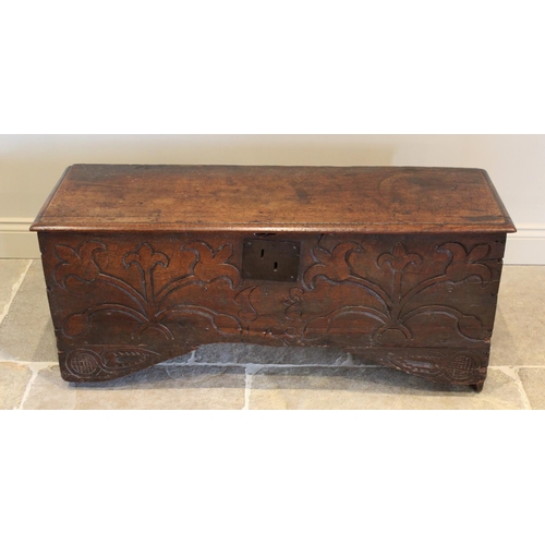 608 - An early eighteenth century oak six plank coffer, the rectangular moulded top opening to an integrat... 