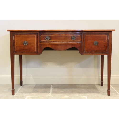 623 - A Regency mahogany sideboard, the break bow front with central frieze drawer flanked by cupboard doo... 