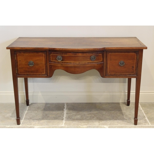 623 - A Regency mahogany sideboard, the break bow front with central frieze drawer flanked by cupboard doo... 