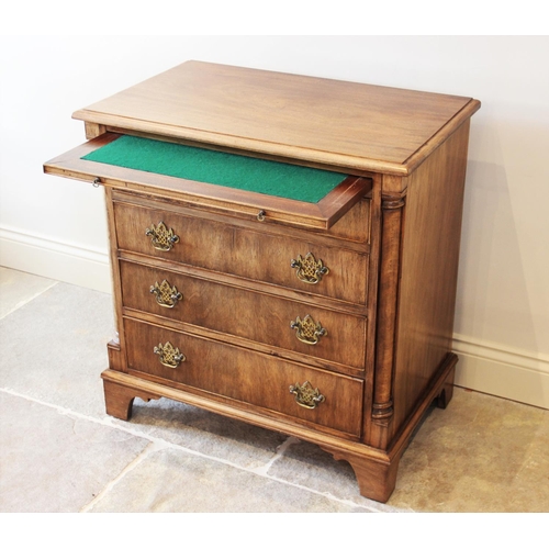 634 - A George III style mahogany bachelors chest, the rectangular thumb moulded top above a baize inset b... 