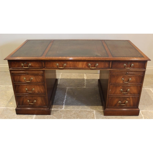 645 - A George III style mahogany twin pedestal desk, late 20th century, by Reprodux, the rectangular moul... 