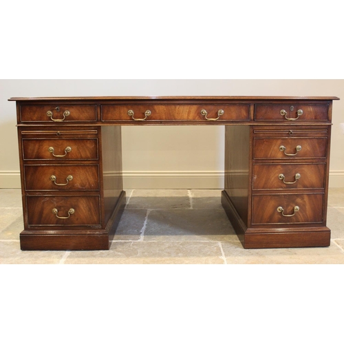 645 - A George III style mahogany twin pedestal desk, late 20th century, by Reprodux, the rectangular moul... 