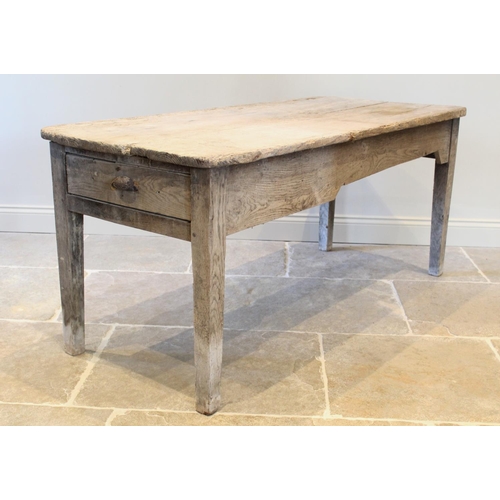 660 - A 19th century rustic pine slab top farmhouse kitchen table, the rectangular top above a single frie... 