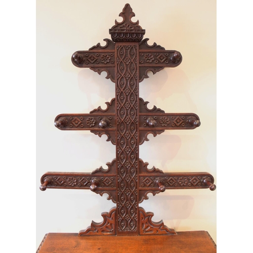 667 - A 17th century style carved oak tree form hall stand, late 19th century, with three graduated branch... 