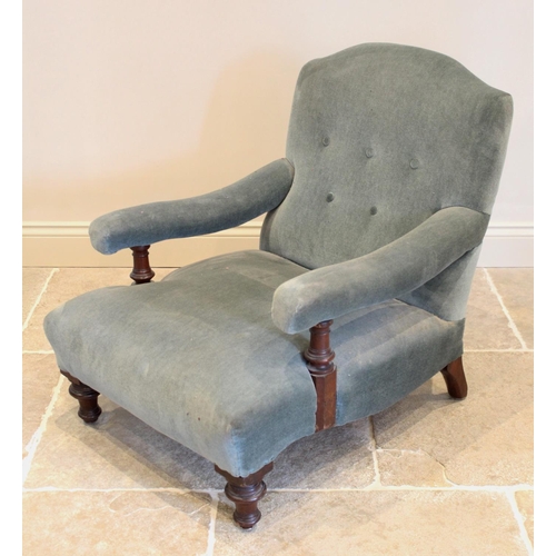 669 - A Victorian Howard type club chair, in blue velour, the serpentine button back flanked by padded arm... 