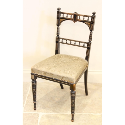 677 - A late Victorian ebonised Aesthetic movement side chair, the spindled rail back above a foliate fabr... 