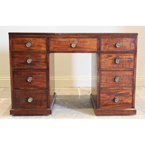 685 - A 19th century mahogany faux partners desk, the rectangular top with an inset gilt tooled green skiv... 